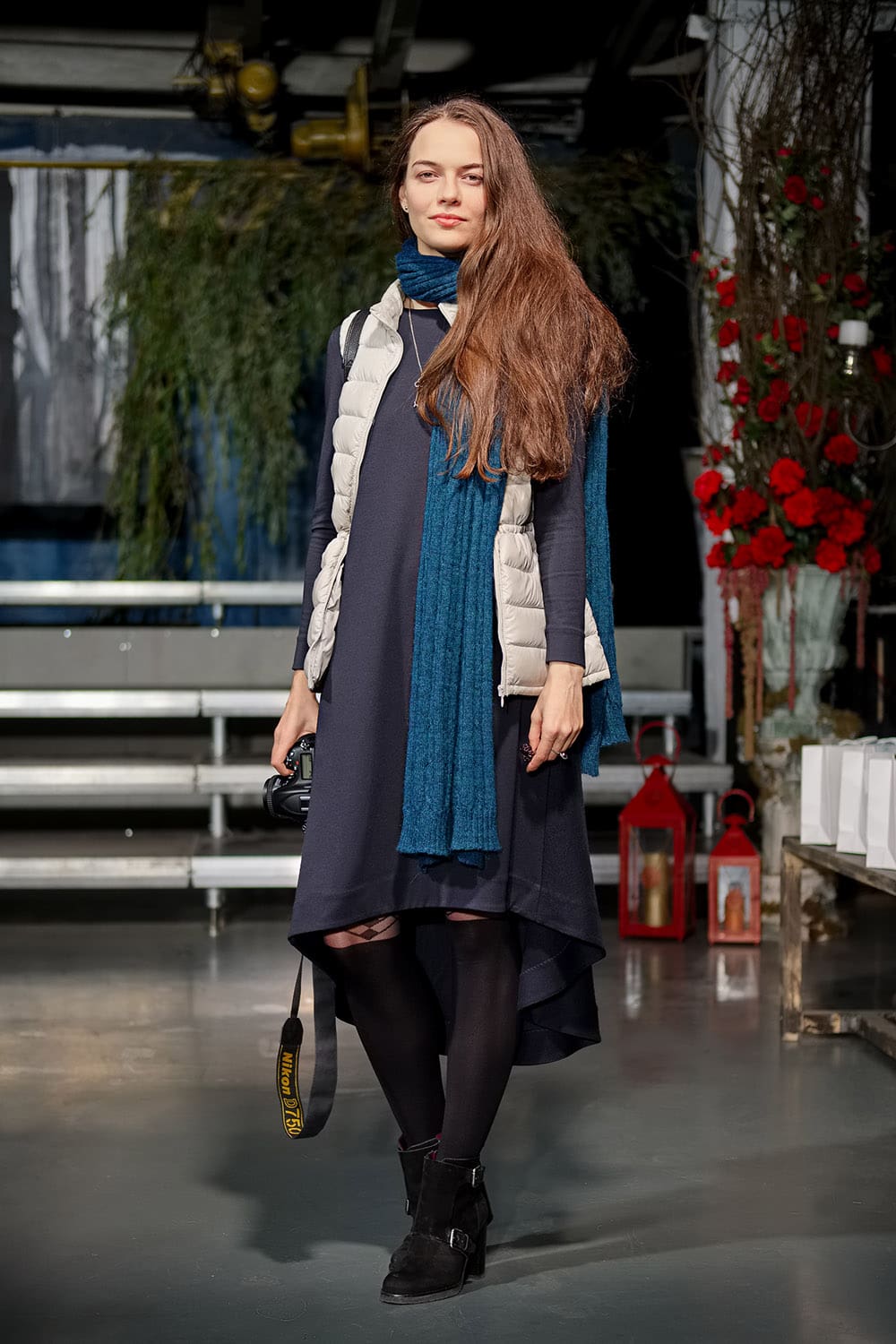 Fashion blogger with camera on stage